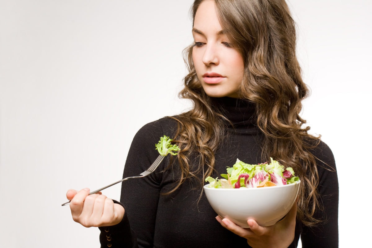 woman holding salad bowl