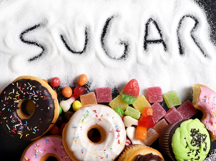 Mix Of Sweet Cakes, Donuts And Candy With Sugar Spread And Written