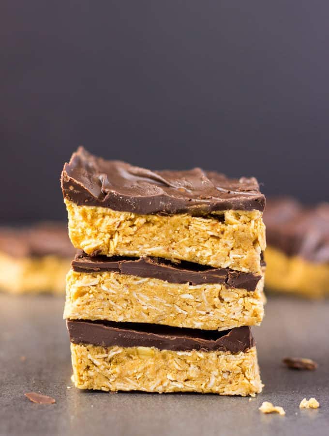 These 4-ingredient peanut butter & oatmeal bars are healthy, no-bake, and protein-packed. These delicious, clean eating Reese flavored protein bars are the perfect post-workout treat. Quick and easy to make, it only takes one bowl and a few minutes of your time to whip those up. Rolled oats are used for the base of this flourless recipe, which is also vegan, dairy-free, gluten-free and... guilt-free! | www.onecleverchef.com