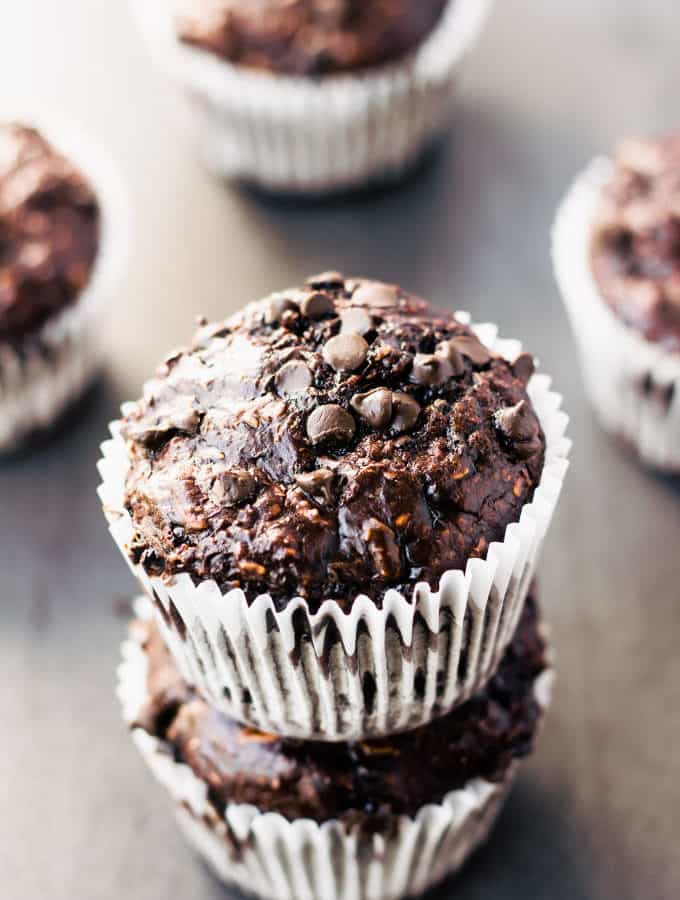 These delicious chocolate protein muffins are the perfect way to reward yourself after a hard workout. Super moist and cakey, these healthy chocolate protein snacks are naturally sweetened with banana and maple syrup. Gluten-free, vegan, dairy-free, egg-free, flourless, kid-friendly and refined sugar-free. | www.onecleverchef.com