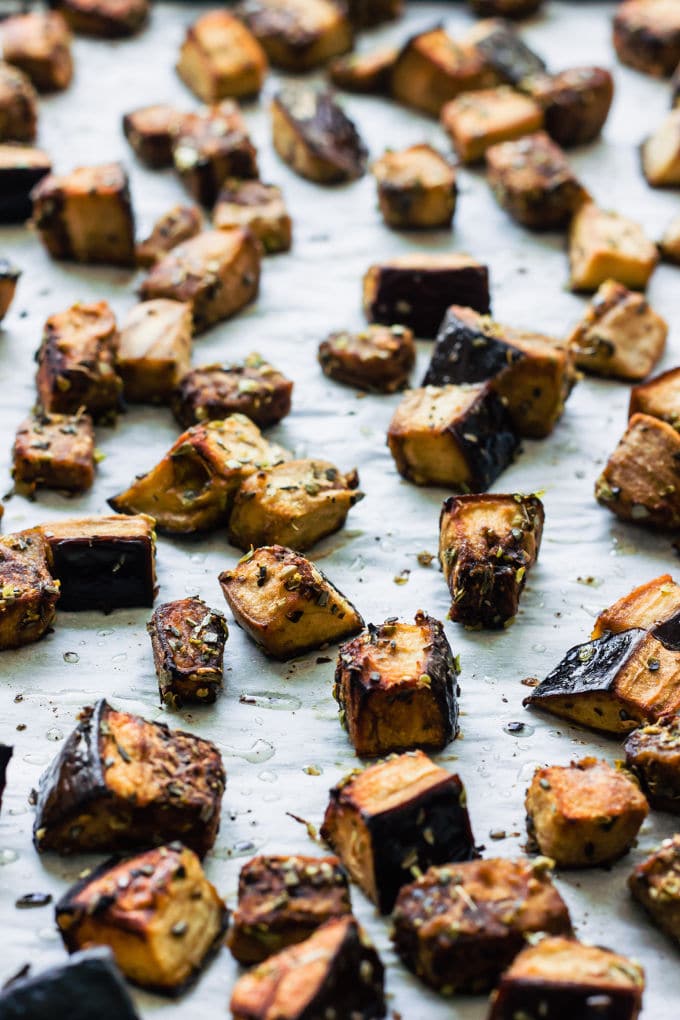 These oven roasted eggplant cubes are a delicious, much healthier alternative to potato fries. The recipe for the balsamic vinaigrette is of Mediterranean inspiration with strong Greek flavors. Super easy to make and 100% healthy, this recipe is also entirely paleo, gluten-free, vegan, low-carb, dairy-free, flourless, nut-free and egg-free. | www.onecleverchef.com
