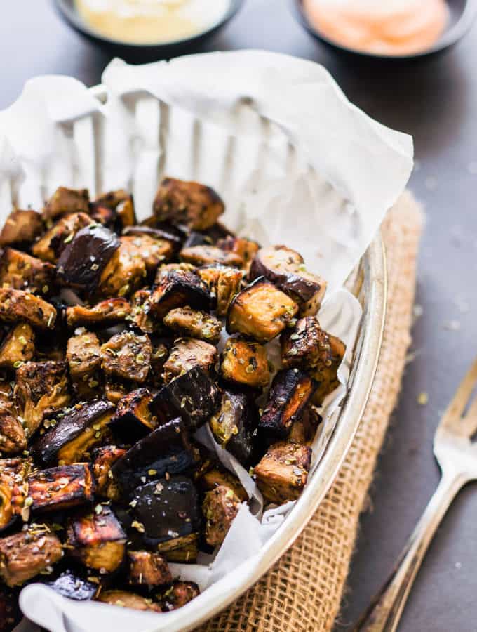 These oven roasted eggplant cubes are a delicious, much healthier alternative to potato fries. The recipe for the balsamic vinaigrette is of Mediterranean inspiration with strong Greek flavors. While being 100% healthy, this recipe is also entirely paleo, gluten-free, vegan, low-carb, dairy-free, flourless, nut-free and egg-free. | www.onecleverchef.com
