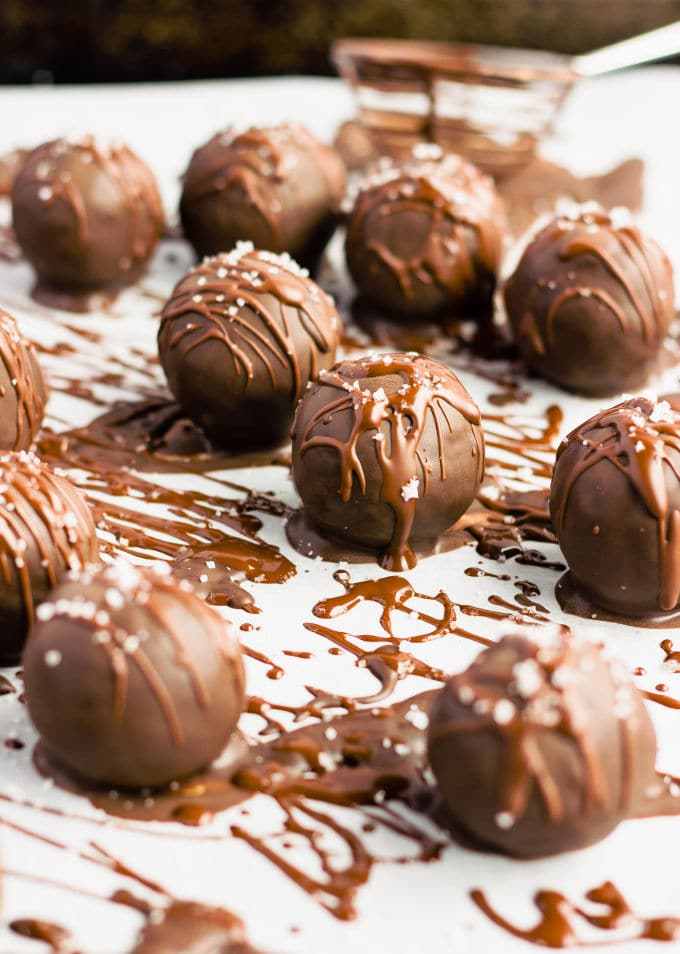 These chocolate covered protein bounty balls are a healthy, homemade version of the classic candy bar. Made of only 6 simple ingredients, these easy to make protein balls are the perfect post-workout treat. This no-bake recipe is also paleo, vegan, gluten-free, flourless, dairy-free and… guilt-free! | www.onecleverchef.com #paleo #vegan #glutenfree #postworkout #protein #healthy #treat #cleaneating