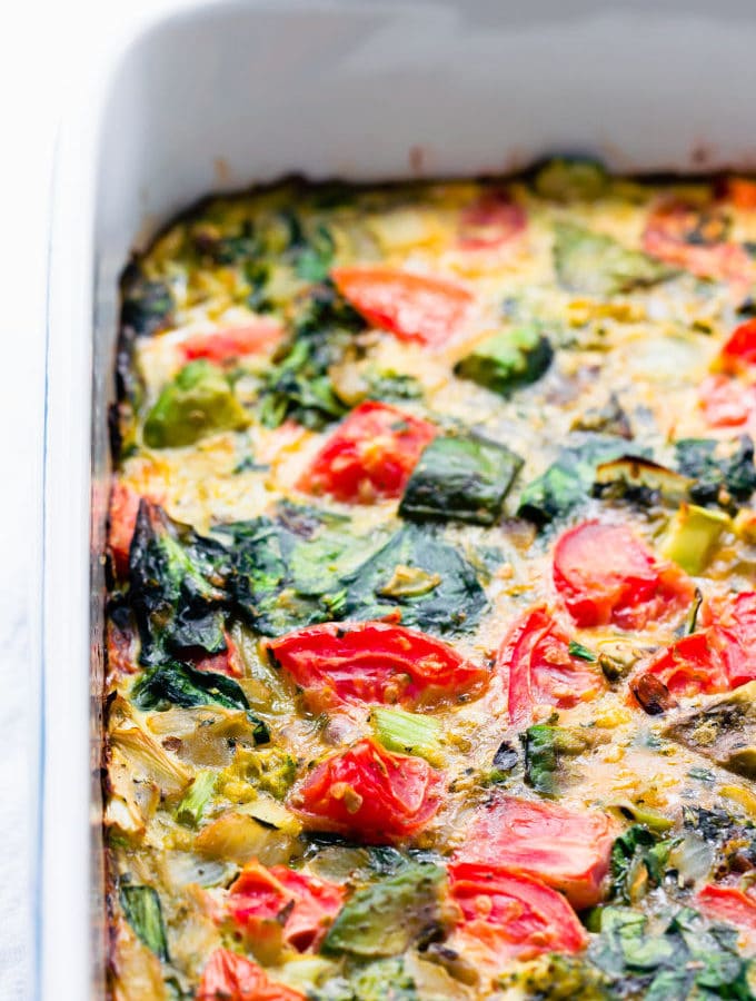 This whole30 breakfast casserole recipe is made with nothing but eggs and nutritious veggies like spinach, eggplant, avocado, broccoli and tomato. This healthy breakfast bake is the perfect easy dish for a family brunch. It is also vegetarian, paleo, low-carb, dairy-free and gluten-free. | onecleverchef.com #glutenfree #vegetarian #breakfast #cleaneating #whole30 #lowcarb #onecleverchef
