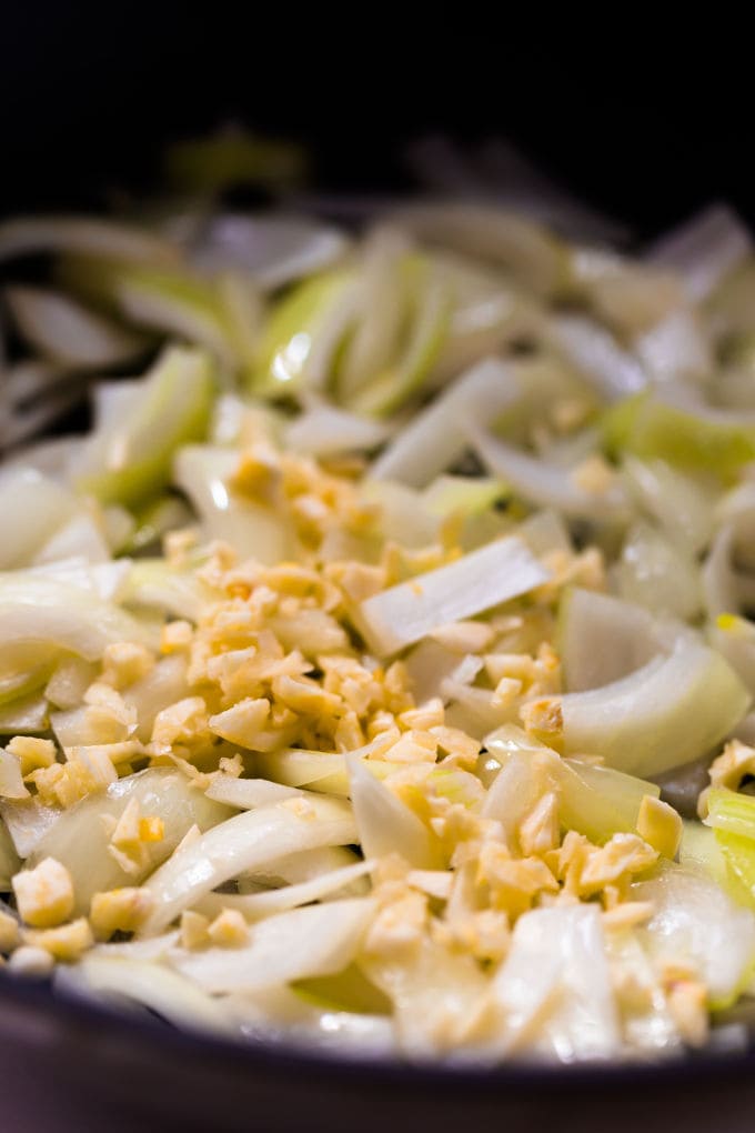 Sauteed onion with uncooked minced garlic on top.