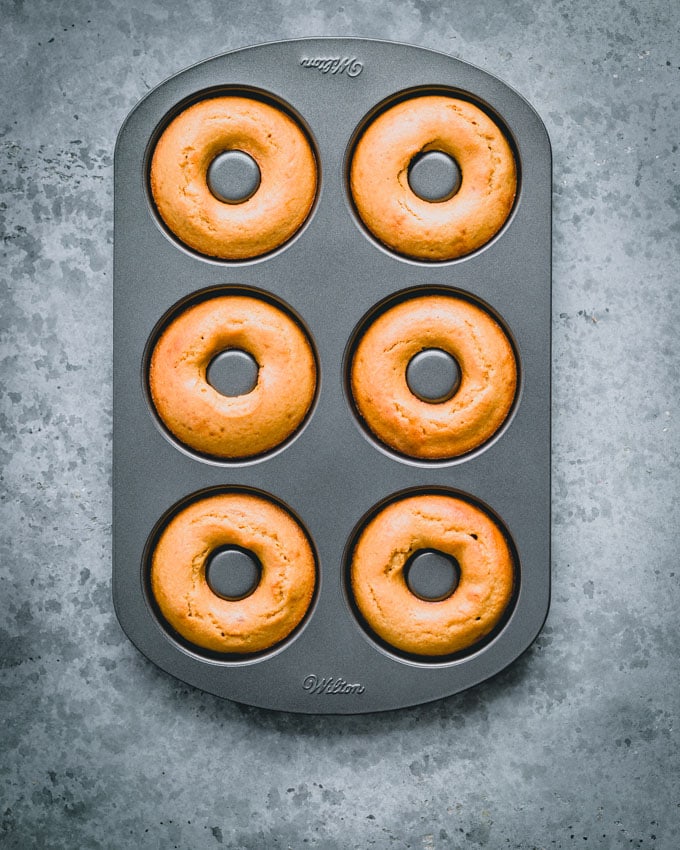 Six protein donuts in a donut pan
