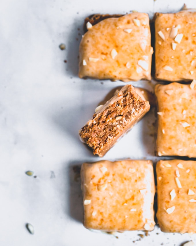 Caramel oatmeal protein bars on a white background