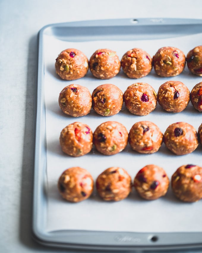 Cranberry Almond Granola Protein Balls on a baking pan