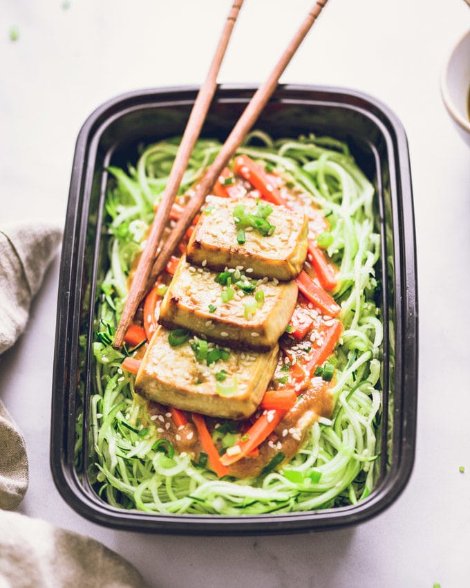 One Vegan Peanut Butter Tofu on Zoodles serving in a meal prep container